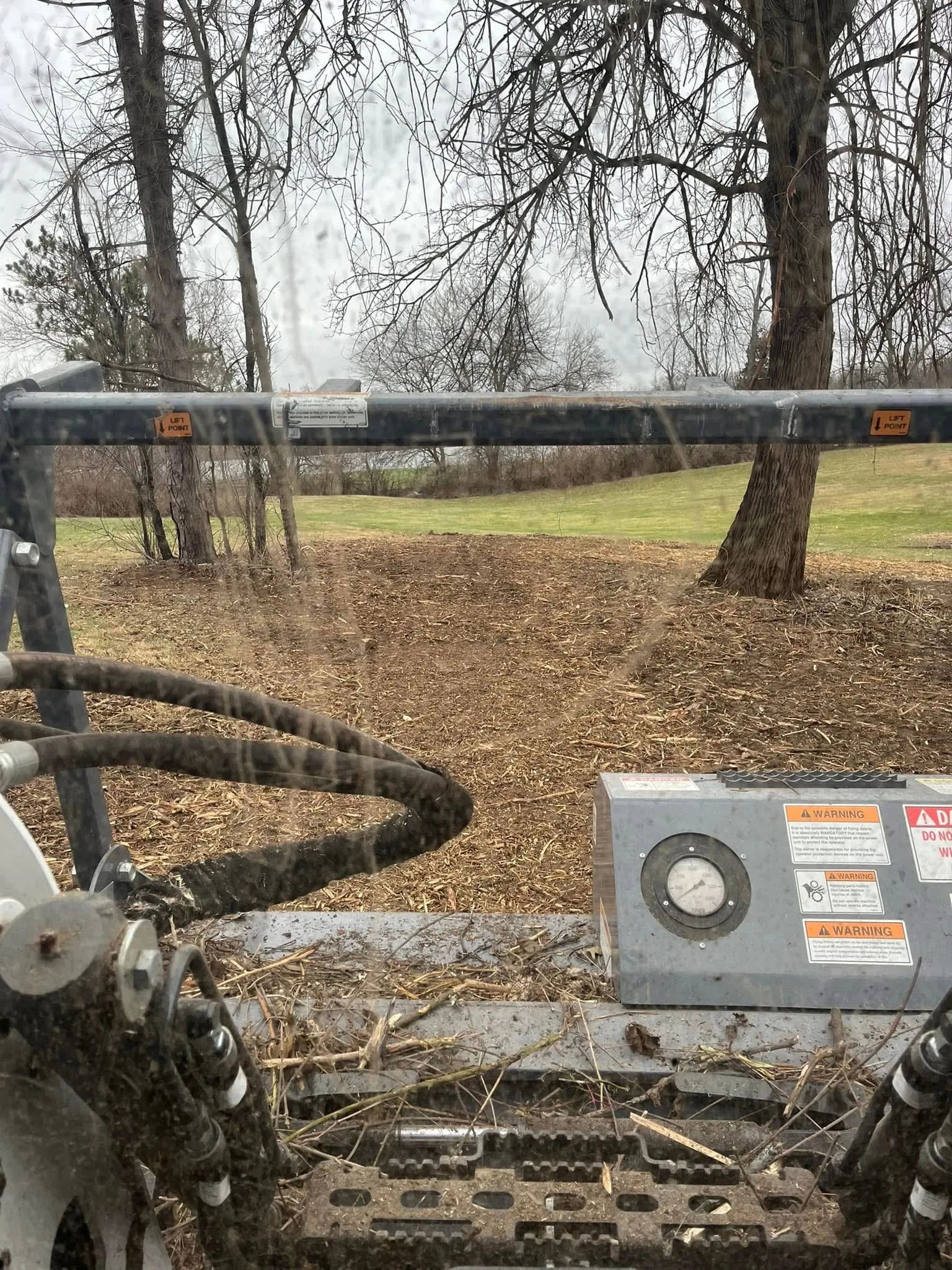 Brush hogging job in progress clearing overgrown field in Northwest Ohio